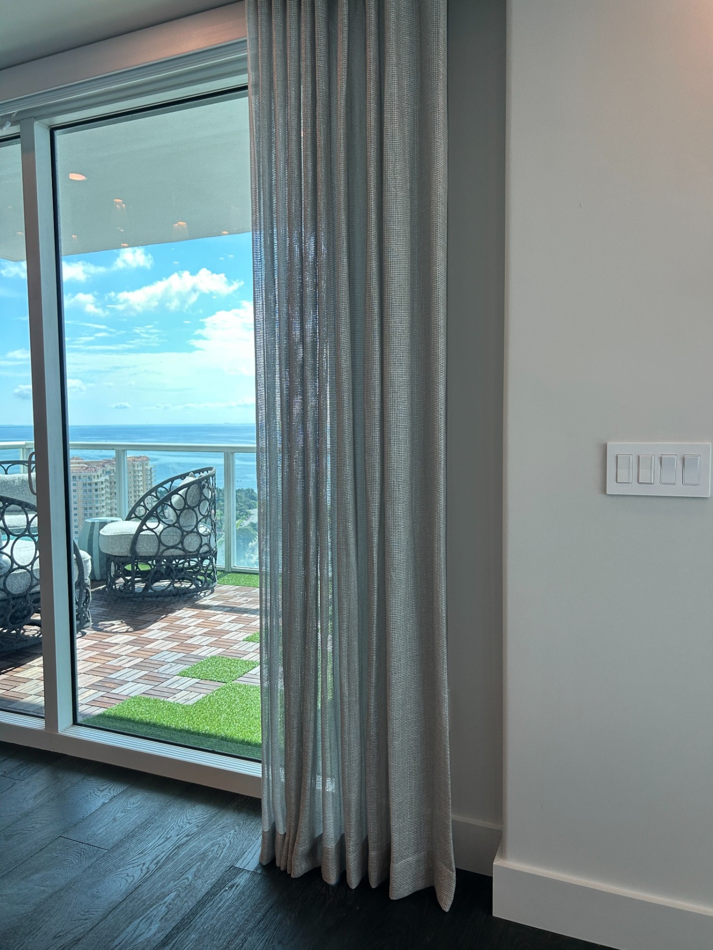 Sheer drapery framing bay view